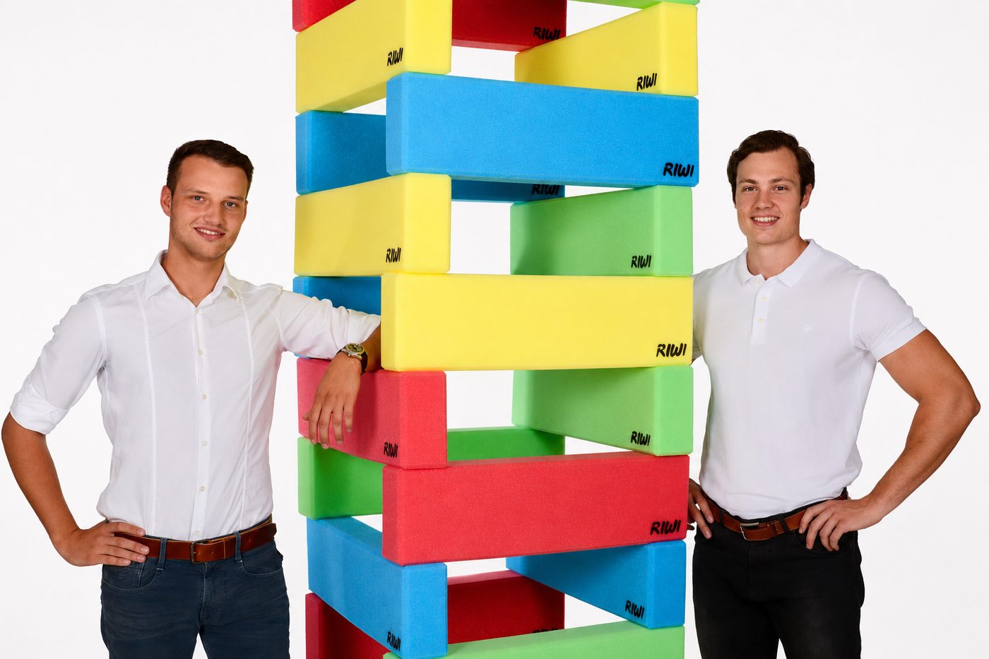The RIWI® founders Roland (left) and Nicola (right) beside a tower of RIWI building blocks